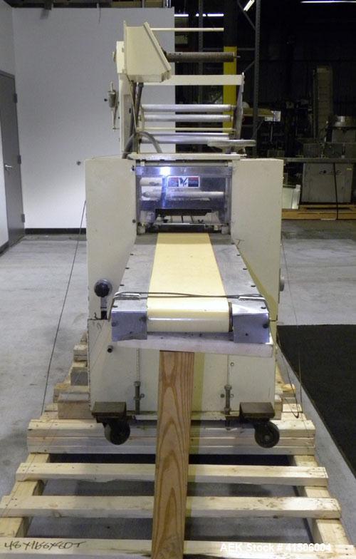 Used Doboy Mustang Horizontal Wrapper. Capable of speeds up to 90 packages per minute. Has a package size range of 1/2" to 7" width x 3" to 15" length, and a maximum height up to 2-3/4". Has an 8" wi...