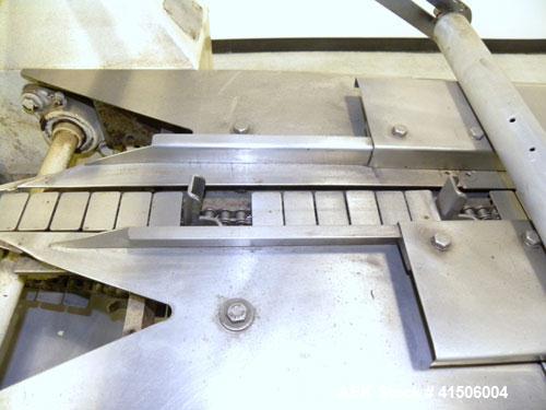 Used Doboy Mustang Horizontal Wrapper. Capable of speeds up to 90 packages per minute. Has a package size range of 1/2" to 7" width x 3" to 15" length, and a maximum height up to 2-3/4". Has an 8" wi...