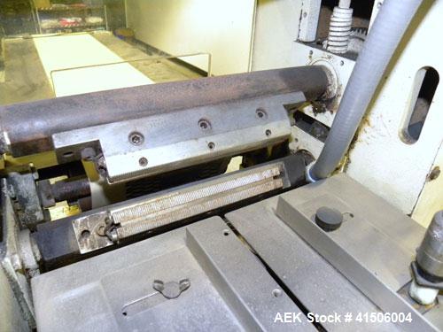 Used Doboy Mustang Horizontal Wrapper. Capable of speeds up to 90 packages per minute. Has a package size range of 1/2" to 7" width x 3" to 15" length, and a maximum height up to 2-3/4". Has an 8" wi...