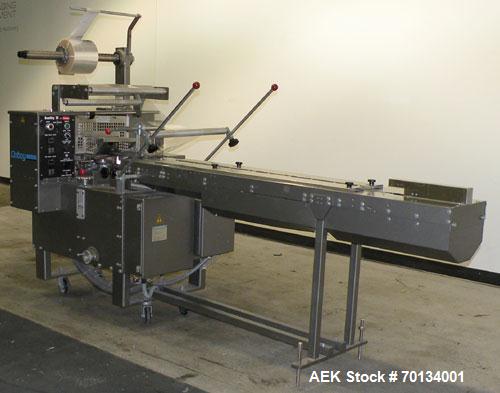 Used Doboy Scotty II Horizontal Flow Wrapper. Capable of speeds up to 75 packages per minute. Has 5' Long lugged chain infeed. Package size range: length 4" to 15", width 1" to 5-1/2", height up to 2...