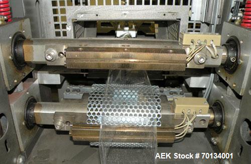 Used Doboy Scotty II Horizontal Flow Wrapper. Capable of speeds up to 75 packages per minute. Has 5' Long lugged chain infeed. Package size range: length 4" to 15", width 1" to 5-1/2", height up to 2...