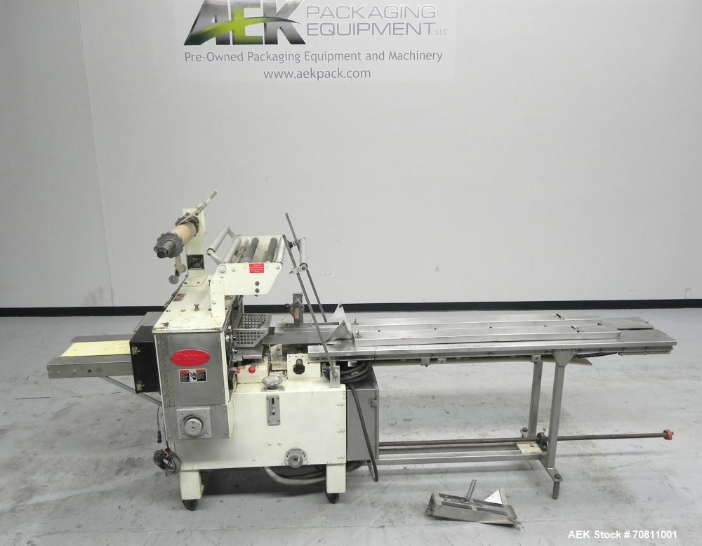 Used Doboy Model Scotty II Horizontal Flow Wrapper. Machine is capable of speeds up to 60 packages per minute. Has 6' Long lugged Carrier Style chain infeed on 12” centers. Package size range: (lengt...