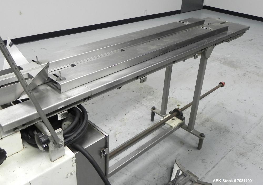 Used Doboy Model Scotty II Horizontal Flow Wrapper. Machine is capable of speeds up to 60 packages per minute. Has 6' Long lugged Carrier Style chain infeed on 12” centers. Package size range: (lengt...