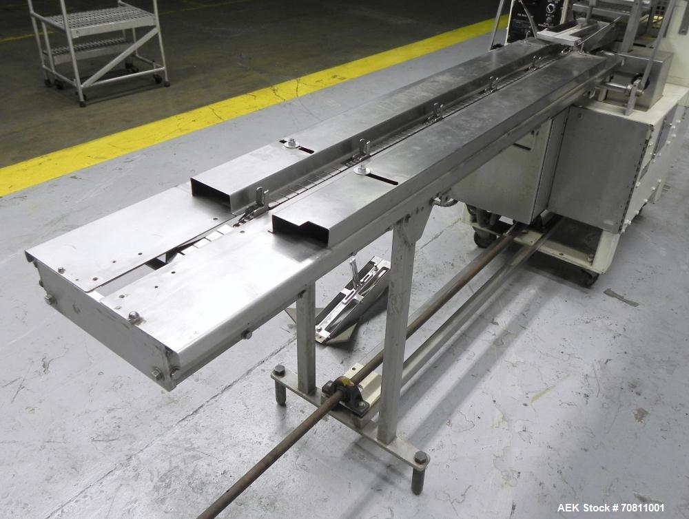 Used Doboy Model Scotty II Horizontal Flow Wrapper. Machine is capable of speeds up to 60 packages per minute. Has 6' Long lugged Carrier Style chain infeed on 12” centers. Package size range: (lengt...