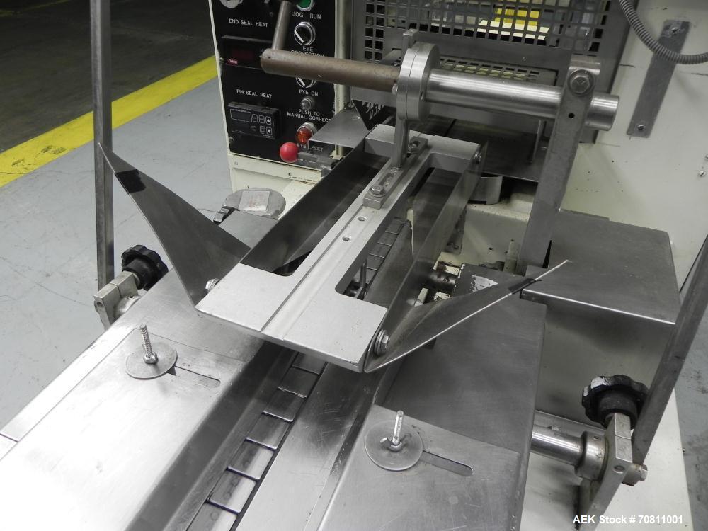 Used Doboy Model Scotty II Horizontal Flow Wrapper. Machine is capable of speeds up to 60 packages per minute. Has 6' Long lugged Carrier Style chain infeed on 12” centers. Package size range: (lengt...