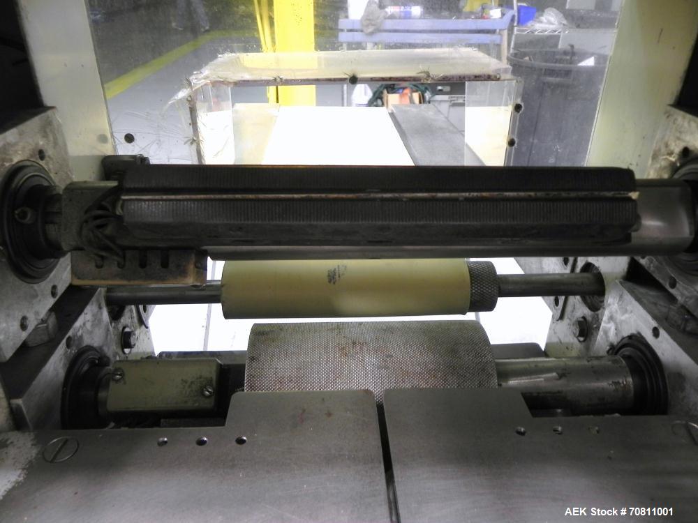 Used Doboy Model Scotty II Horizontal Flow Wrapper. Machine is capable of speeds up to 60 packages per minute. Has 6' Long lugged Carrier Style chain infeed on 12” centers. Package size range: (lengt...