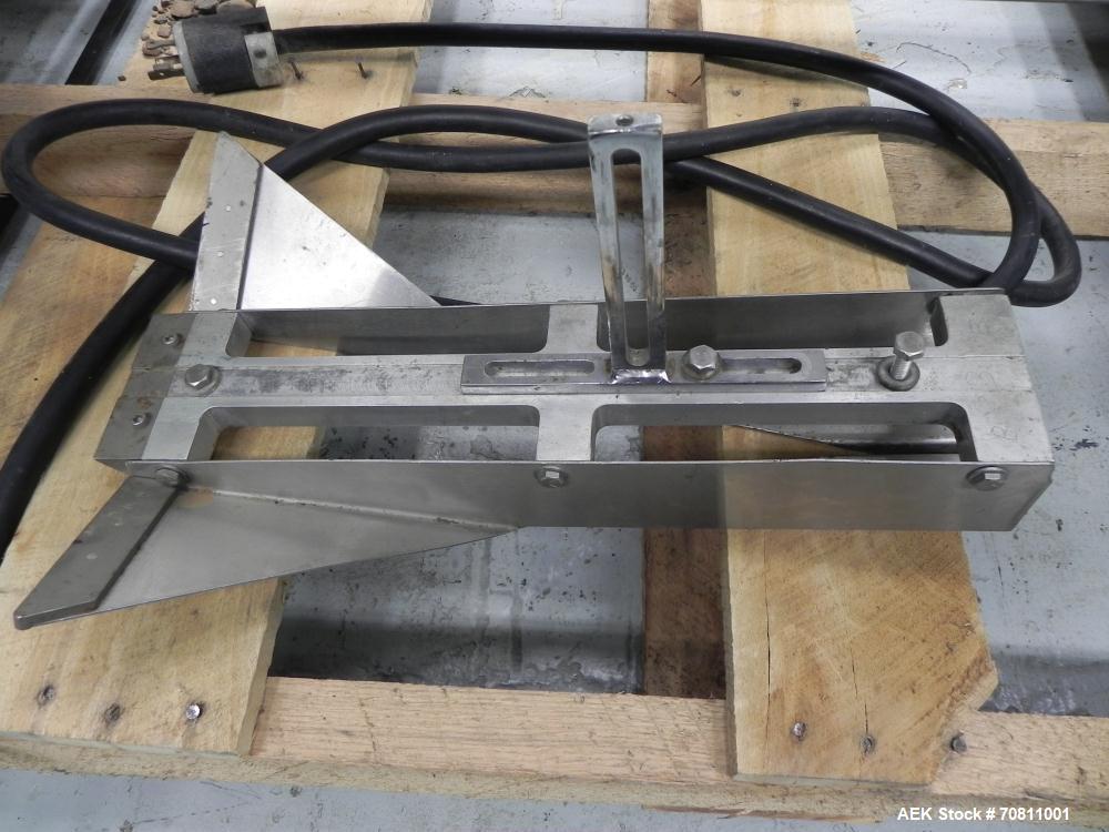 Used Doboy Model Scotty II Horizontal Flow Wrapper. Machine is capable of speeds up to 60 packages per minute. Has 6' Long lugged Carrier Style chain infeed on 12” centers. Package size range: (lengt...