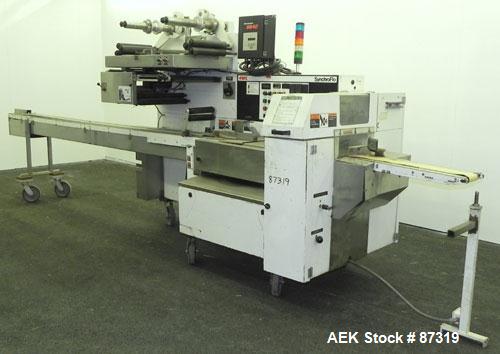 Used FMC Model WM20 SynchroFlo Horizontal Wrapper. Speeds up uo 300 packages per minute. 2 up cutting head, 1 1/2" wide x 7" long. Approximate 142" long lug chain infeed with carrier chain currently ...