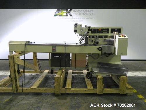 Used Ilapak Lynx Compak Model DUE Horizontal Wrapper capable of speeds up to 130 packages per minute. Has a two up sealing head and 2 speed 6' long lugged chain infeed on 9" centers with carrier chai...