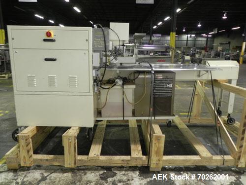 Used Ilapak Lynx Compak Model DUE Horizontal Wrapper capable of speeds up to 130 packages per minute. Has a two up sealing head and 2 speed 6' long lugged chain infeed on 9" centers with carrier chai...