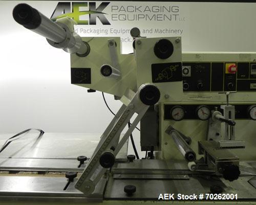 Used Ilapak Lynx Compak Model DUE Horizontal Wrapper capable of speeds up to 130 packages per minute. Has a two up sealing head and 2 speed 6' long lugged chain infeed on 9" centers with carrier chai...
