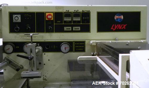 Used Ilapak Lynx Compak Model DUE Horizontal Wrapper capable of speeds up to 130 packages per minute. Has a two up sealing head and 2 speed 6' long lugged chain infeed on 9" centers with carrier chai...