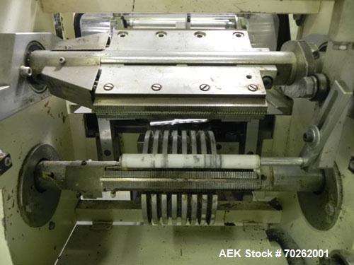 Used Ilapak Lynx Compak Model DUE Horizontal Wrapper capable of speeds up to 130 packages per minute. Has a two up sealing head and 2 speed 6' long lugged chain infeed on 9" centers with carrier chai...