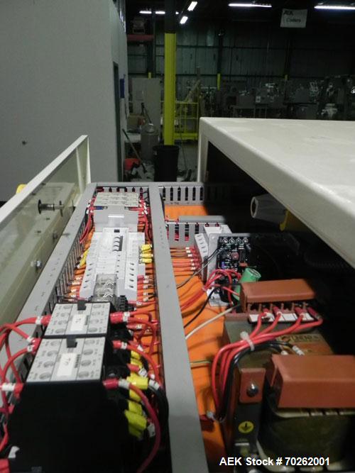Used Ilapak Lynx Compak Model DUE Horizontal Wrapper capable of speeds up to 130 packages per minute. Has a two up sealing head and 2 speed 6' long lugged chain infeed on 9" centers with carrier chai...