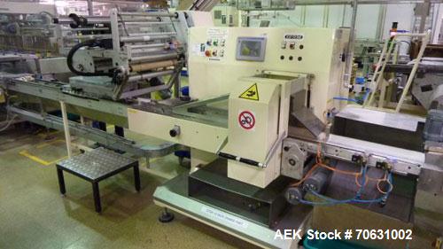 Used Otem M300DX Flowpack Wrapper.  Maximum pack height 3.5" (90 mm).  Maximum pack length 15" (380 mm).  Knives 9.4" (240 mm) long.  Maximum pack width 7.8" (200 mm).  Optional cardboard base feeder...