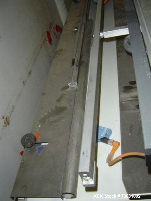 Used Otem M300DX Flowpack Wrapper.  Maximum pack height 3.5" (90 mm).  Maximum pack length 15" (380 mm).  Knives 9.4" (240 mm) long.  Maximum pack width 7.8" (200 mm).  Optional cardboard base feeder...