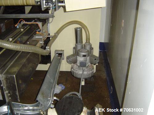 Used Otem M300DX Flowpack Wrapper.  Maximum pack height 3.5" (90 mm).  Maximum pack length 15" (380 mm).  Knives 9.4" (240 mm) long.  Maximum pack width 7.8" (200 mm).  Optional cardboard base feeder...