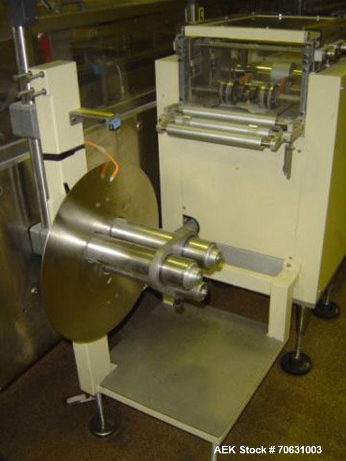 Used Otem M300DX Flowpack Wrapper. Maximum pack height 3.5" (90 mm). Maximum pack length 15" (380 mm). Knives 9.4" (240 mm) long. Maximum pack width 7.8" (200 mm). Optional cardboard base feeder. Com...