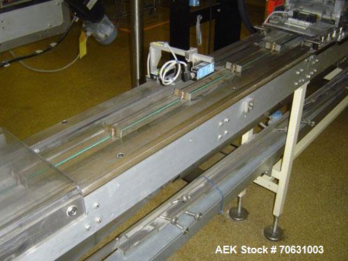 Used Otem M300DX Flowpack Wrapper. Maximum pack height 3.5" (90 mm). Maximum pack length 15" (380 mm). Knives 9.4" (240 mm) long. Maximum pack width 7.8" (200 mm). Optional cardboard base feeder. Com...