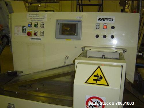 Used Otem M300DX Flowpack Wrapper. Maximum pack height 3.5" (90 mm). Maximum pack length 15" (380 mm). Knives 9.4" (240 mm) long. Maximum pack width 7.8" (200 mm). Optional cardboard base feeder. Com...