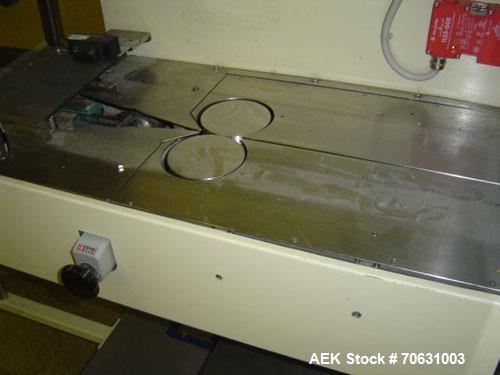 Used Otem M300DX Flowpack Wrapper. Maximum pack height 3.5" (90 mm). Maximum pack length 15" (380 mm). Knives 9.4" (240 mm) long. Maximum pack width 7.8" (200 mm). Optional cardboard base feeder. Com...