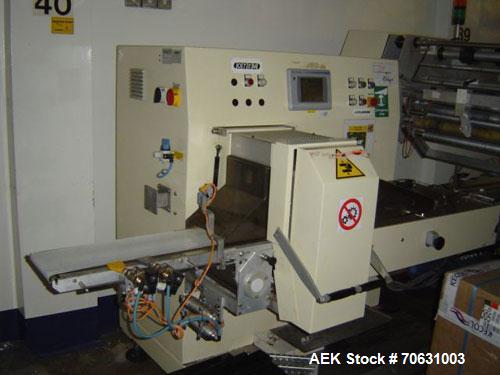 Used Otem M300DX Flowpack Wrapper. Maximum pack height 3.5" (90 mm). Maximum pack length 15" (380 mm). Knives 9.4" (240 mm) long. Maximum pack width 7.8" (200 mm). Optional cardboard base feeder. Com...