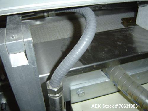 Used Otem M300DX Flowpack Wrapper. Maximum pack height 3.5" (90 mm). Maximum pack length 15" (380 mm). Knives 9.4" (240 mm) long. Maximum pack width 7.8" (200 mm). Optional cardboard base feeder. Com...