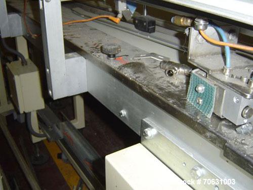 Used Otem M300DX Flowpack Wrapper. Maximum pack height 3.5" (90 mm). Maximum pack length 15" (380 mm). Knives 9.4" (240 mm) long. Maximum pack width 7.8" (200 mm). Optional cardboard base feeder. Com...