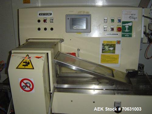 Used Otem M300DX Flowpack Wrapper. Maximum pack height 3.5" (90 mm). Maximum pack length 15" (380 mm). Knives 9.4" (240 mm) long. Maximum pack width 7.8" (200 mm). Optional cardboard base feeder. Com...