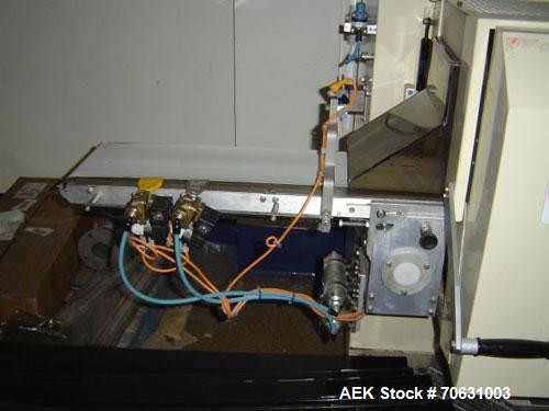 Used Otem M300DX Flowpack Wrapper. Maximum pack height 3.5" (90 mm). Maximum pack length 15" (380 mm). Knives 9.4" (240 mm) long. Maximum pack width 7.8" (200 mm). Optional cardboard base feeder. Com...