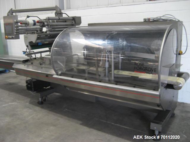 Used Rose Forgrove Flow Wrapping Machine, Model Integra 602. Stainless steel construction. Speeds up to 150 pieces per minute (depending on product size and film material). Long dwell crimping statio...
