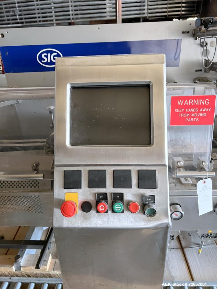 Used SIG Horizontal Flow Wrapper, Model HBM. Wrapper is rated for speeds from 50 to 350 packages per minute. Has a 7.5" serrated blade seal jaw for a package size range of 2" to 20" in length, up to ...