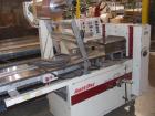 Used Ameripak Model 140S Horizontal Wrapper capable of speeds up to 100 feet per minute. Printed Film Registered Wrapper is convertible with modular fin seal assemblies for either shrink or supported...