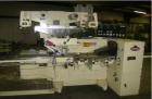 Used Doboy Model J Horizontal Wrapper capable of speeds over 200 packages per minute. Film registration, 1 up sealing head 12