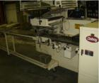 Used Doboy Model J Horizontal Wrapper capable of speeds over 200 packages per minute. Film registration, 1 up sealing head 12