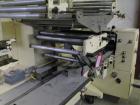 Used Doboy Model J Horizontal Wrapper capable of speeds over 200 packages per minute. Film registration, 1 up sealing head 12