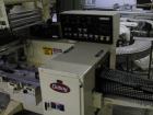 Used Doboy Model J Horizontal Wrapper capable of speeds over 200 packages per minute. Film registration, 1 up sealing head 12