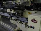 Used Doboy Model J Horizontal Wrapper capable of speeds over 200 packages per minute. Film registration, 1 up sealing head 12