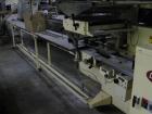 Used Doboy Model J Horizontal Wrapper capable of speeds over 200 packages per minute. Film registration, 1 up sealing head 12