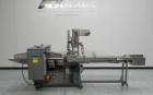 Used Doboy Mustang IV Horizontal Wrapper. Machine is capable of speeds up to 150 cpm. 2 up unit with film registration. Package size range: length up to 15
