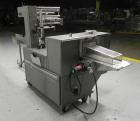 Used Doboy Mustang IV Horizontal Wrapper. Machine is capable of speeds up to 150 cpm. 2 up unit with film registration. Package size range: length up to 15