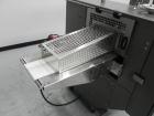 Used Doboy Mustang IV Horizontal Wrapper. Machine is capable of speeds up to 150 cpm. 2 up unit with film registration. Package size range: length up to 15