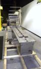 Used Doboy Mustang Horizontal Wrapper. Capable of speeds up to 90 packages per minute. Has a package size range of 1/2