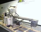 Used Doboy Mustang Horizontal Wrapper. Capable of speeds up to 90 packages per minute. Has a package size range of 1/2