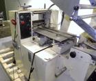 Used Doboy Mustang Horizontal Wrapper. Capable of speeds up to 90 packages per minute. Has a package size range of 1/2