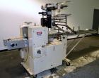 Used Doboy Mustang Horizontal Wrapper. Machine is capable of speeds up to 96 packages per minute. Has a one up head, print registration and Markem 984 hot stamp date coder. Machine has SmartEye senso...