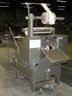 Used Doboy Scotty II Horizontal Flow Wrapper. Capable of speeds up to 75 packages per minute. Has 5' Long lugged chain infeed. Package size range: length 4