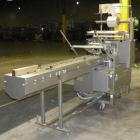 Used Doboy Scotty II Horizontal Flow Wrapper. Capable of speeds up to 75 packages per minute. Has 5' Long lugged chain infeed. Package size range: length 4