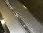 Used Doboy Scotty II Horizontal Flow Wrapper. Capable of speeds up to 75 packages per minute. Has 5' Long lugged chain infeed. Package size range: length 4