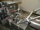 Used Doboy Scotty II Horizontal Flow Wrapper. Capable of speeds up to 75 packages per minute. Has 5' Long lugged chain infeed. Package size range: length 4